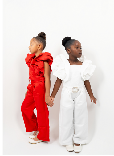 Girl in red shimmer pantsuit with ruffled sleeves and rhinestone belt – festive occasion outfit for toddler and girls
