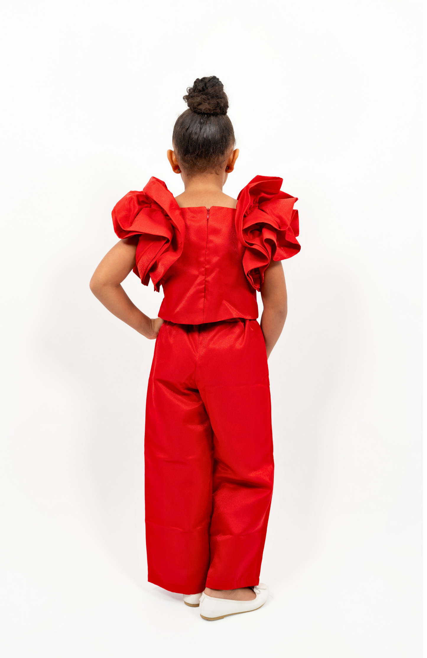 Girl in red shimmer pantsuit with ruffled sleeves and rhinestone belt – festive occasion outfit for toddler and girls