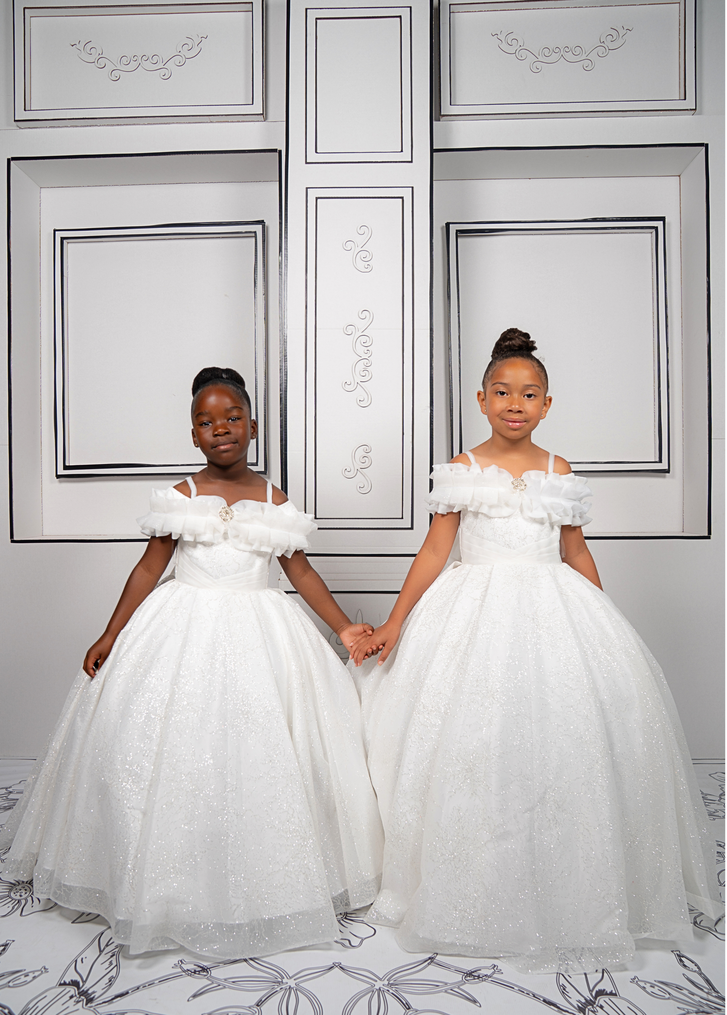 This elegant white ball gown is perfect for flower girls and little brides. With sparkly tulle and a dreamy silhouette, it’s a fairytale favorite.
