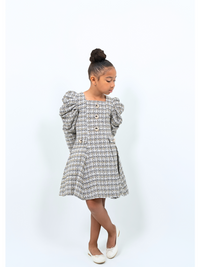 Girl wearing tweed puff sleeve coat dress with gold buttons, ideal for holidays or special events