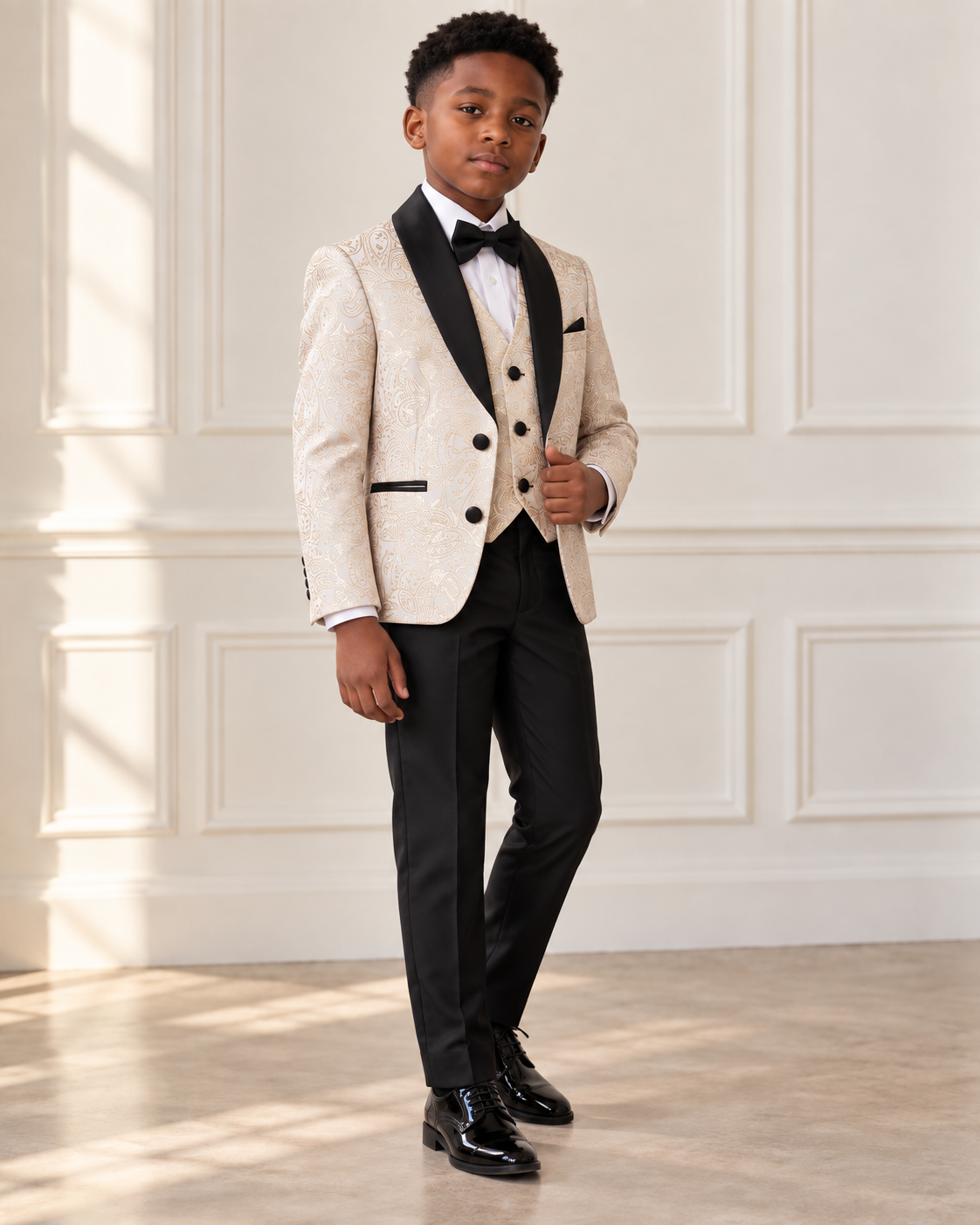 Black boy modeling Beige and Gold 5 Piece Boy Tuxedo - angled view