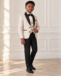 Black boy modeling Beige and Gold 5 Piece Boy Tuxedo - angled view