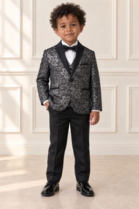 Mixed-race boy wearing black and silver floral suit, front view