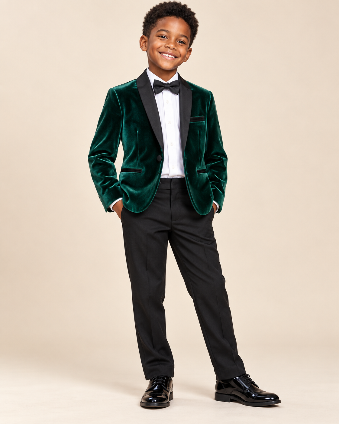 Black boy wearing the Kirsten and Kendall emerald green velvet blazer with black trousers