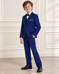 White boy modeling Boys Midnight Blue 3-Piece Suit - angled view