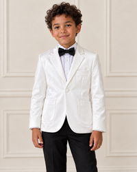 Mixed-race boy modeling the Boys White Velvet Stylish Blazer, detail view