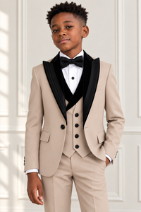 Black boy wearing beige tuxedo with black velvet collar, detail view