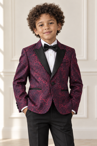 Mixed-race boy wearing burgundy patterned formal suit, detail view
