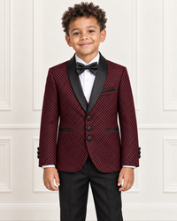 Detail view of mixed-race boy wearing the burgundy shimmery five-piece tuxedo suit
