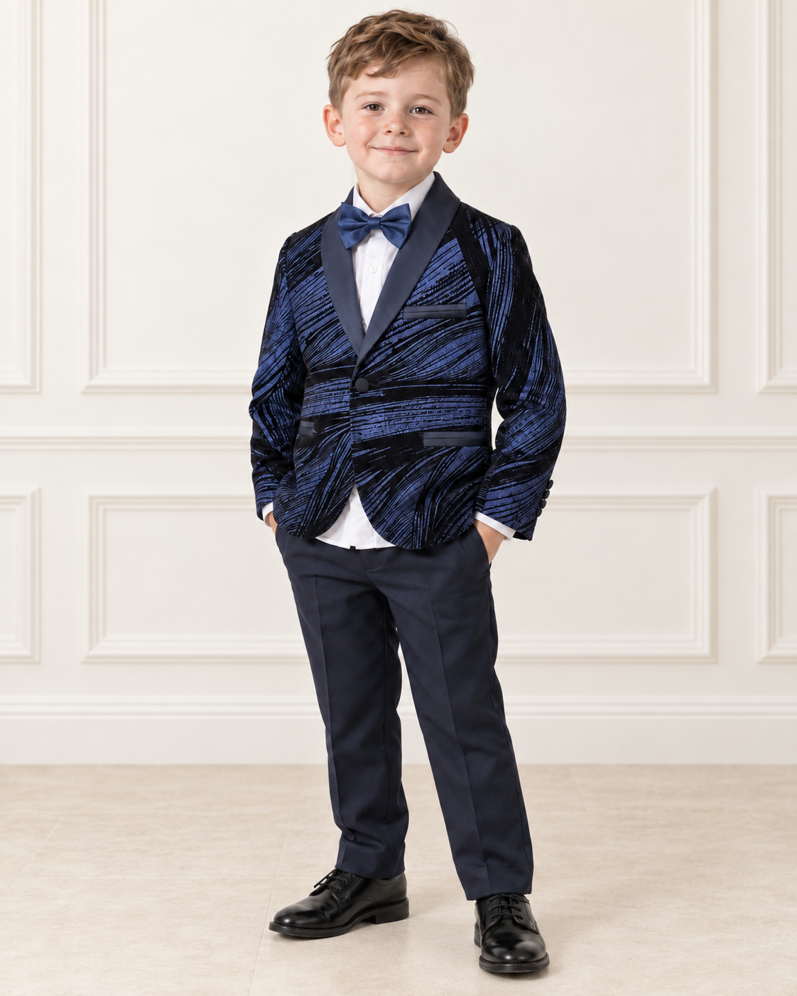White boy wearing navy blue shimmery tuxedo, front view